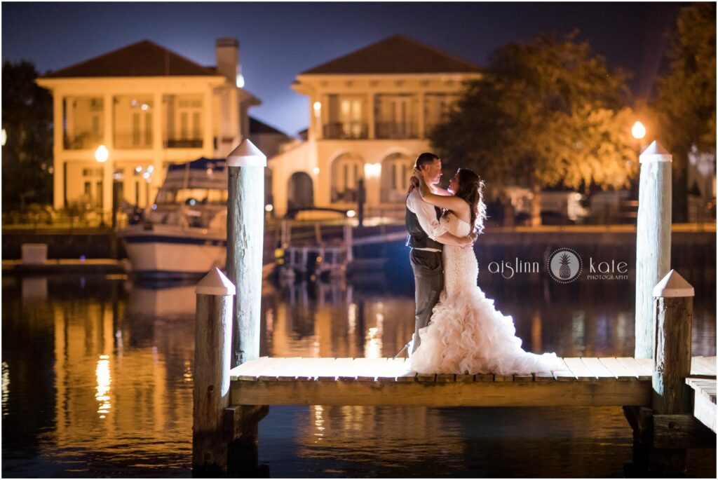 Bride and Groom for photos on the waterfront dock during their Reception at Palafox Wharf Waterfront in Pensacola, Florida