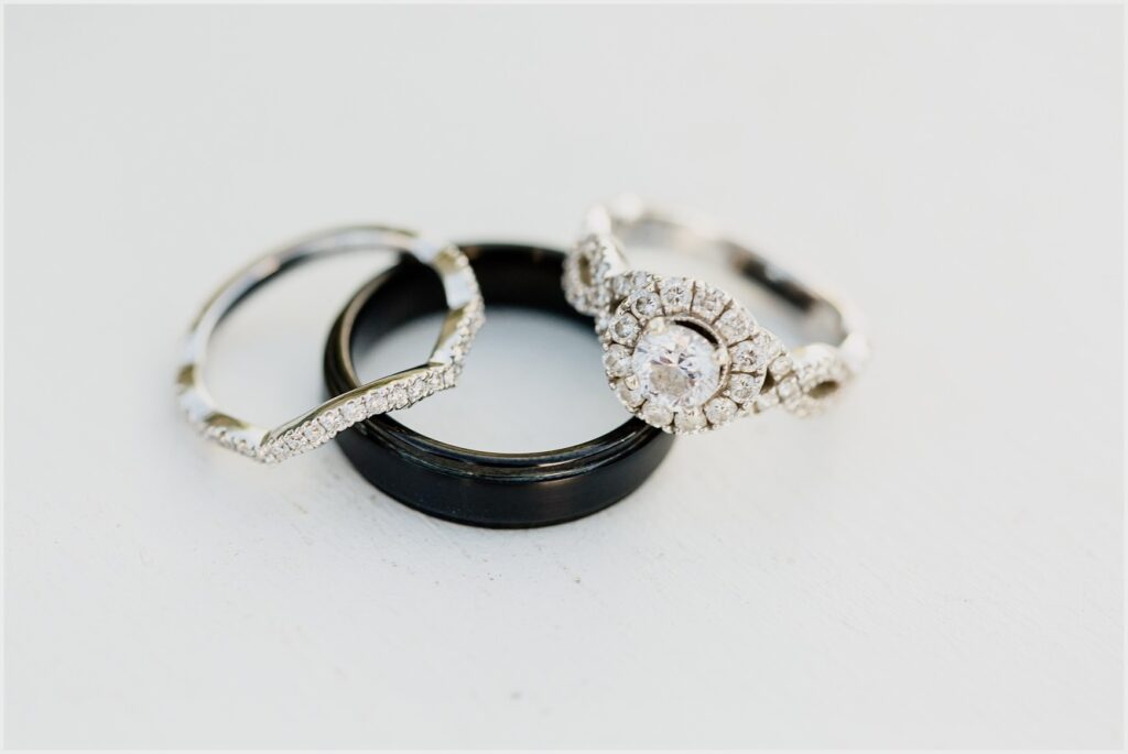 Beautiful diamond rings and black band at palafox wharf waterfront wedding venue one of the pensacola waterfront wedding venues centrally located downtown in the heart of pensacola fl