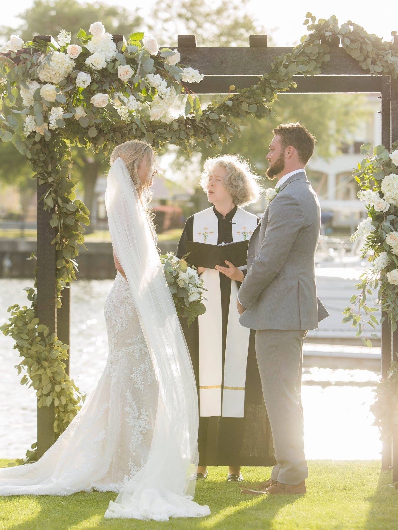 Pick the perfect location and date for your Wedding in downtown on Palafox St in Pensacola, FL on the waterfront and here is an March Wedding Venue couple getting married on the green

