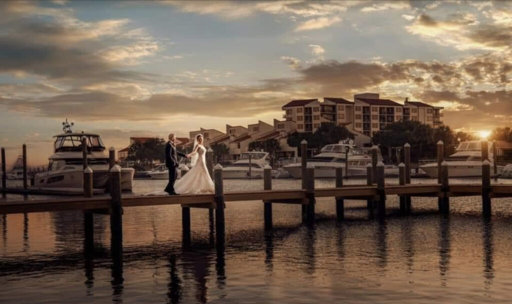 Wedding couple enjoying sunset at Palafox Wharf Waterfront Venue in Pensacola