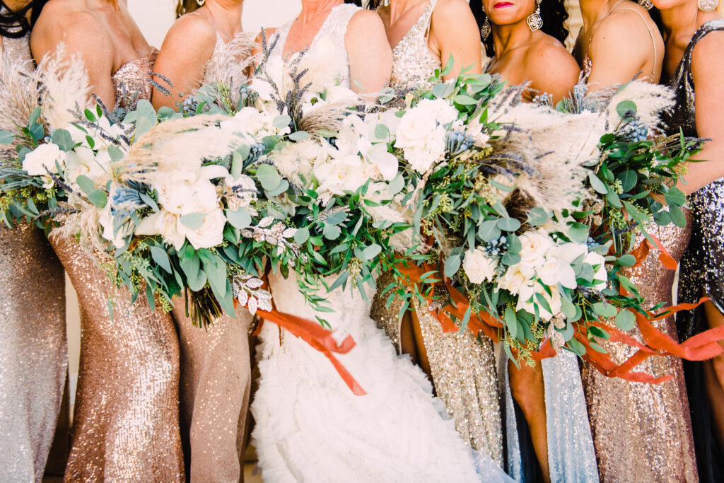 Bride and her girls with sparking gowns with their beautiful bouquets at Palafox Wharf in Pensacola, Florida - the Great Coast Coast of Florida