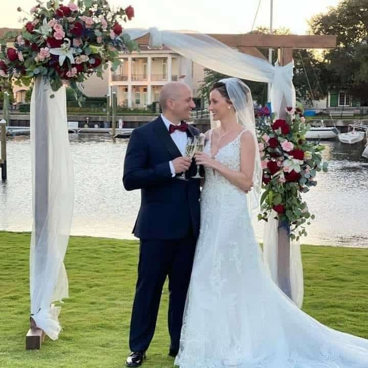 Wedding Couple enjoying Champagne during Photos after Ceremony at Palafox Wharf Waterfront in Pensacola Florida, a pensacola wedding venue