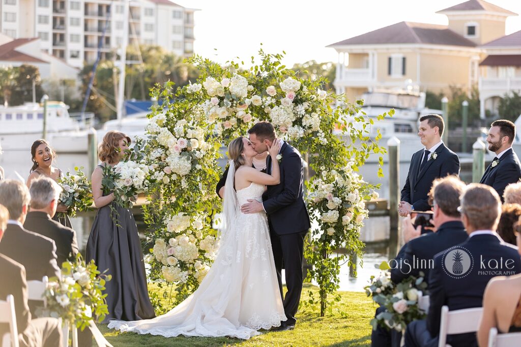 Venue - Elegant Floral Ceremony Arbor Setting on the Green with Scenic view at Palafox Wharf Waterfront Venue in Pensacola, Florida