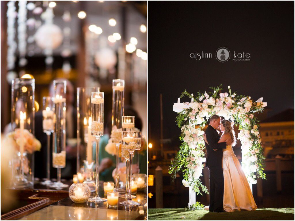 Bride and Groom at Night on the Green at Palafox Wharf Waterfront Venue and Gorgeous Long Stemmed Candle Holders on the Handcrafted Bar in Pensacola, Florida
