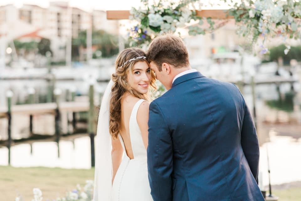 Bride looking at you with Groom just after Ceremony at Palafox Wharf Waterfront in Pensacola FL
