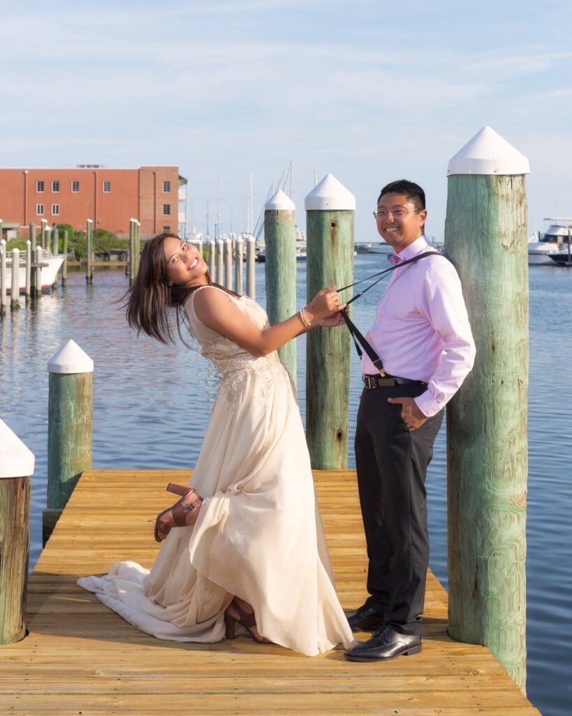 September couple on the T of the dock in Baylen Slip at Palafox Wharf Waterfront Pensacola Florida