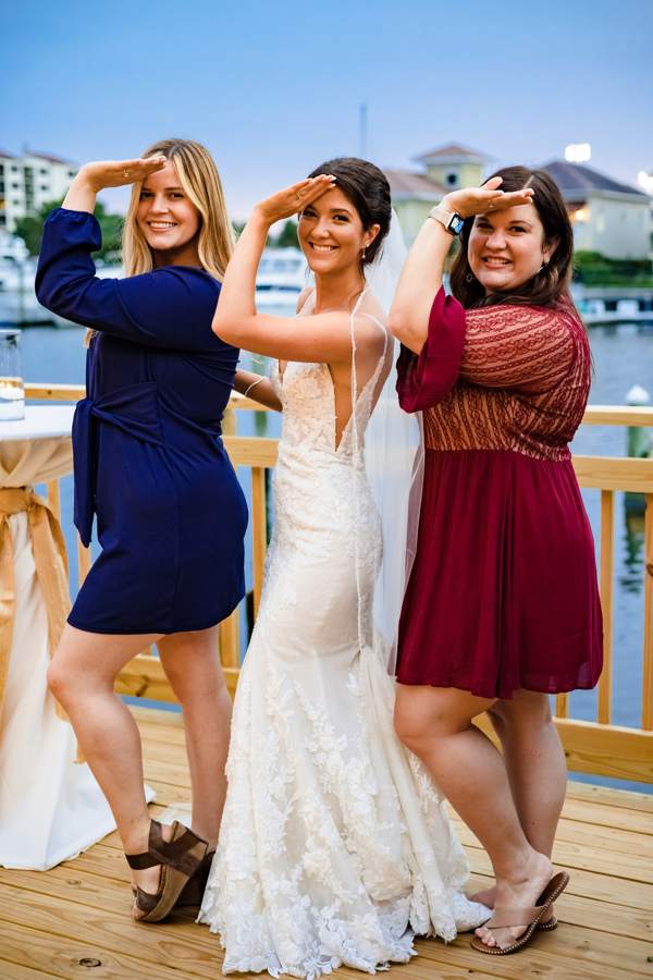 Discover 12 Advantages of Intimate Weddings Are Ideal at Palafox Wharf Waterfront with Wedding Event Destination Bride, works in education in the Music Department, and her wedding friends on deck at Palafox Wharf Waterfront in Pensacola Gulf Coast Florida 