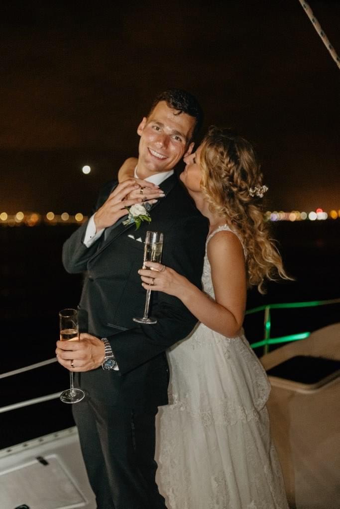 Couple hugging on Boat ride for time alone after Ceremony, Family Photos, and before Reception Dinner.