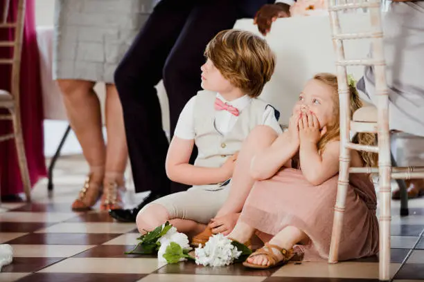 At a Wedding Reception, children playing under a guest table.  http://www.thebarnattwiggys.com/ http://www.celestialfarms22.com/