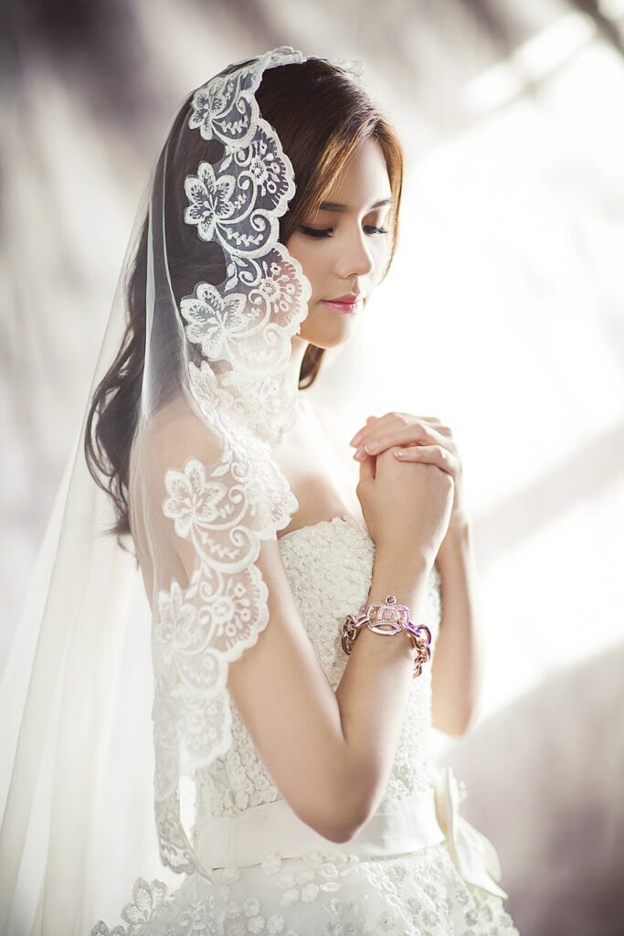 Bride in Gown and Veil with a very light tan