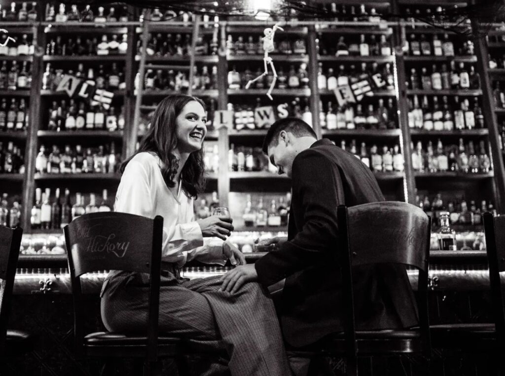 Bridget + Henry, a Palafox Wharf Waterfront couple, out visiting one of Pensacola’s Bar enjoying their favorite drink - photo by Weddings By Adina