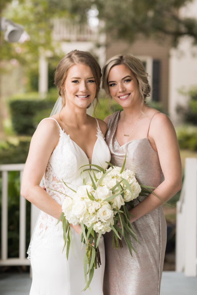 Bride and Maid of Honor together with bouquets and beautiful hair in tropical Pensacola Florida