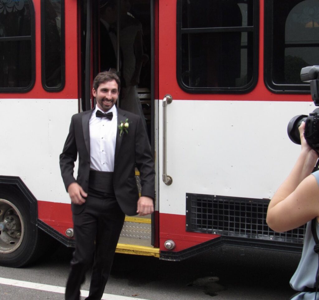 Downtown Pensacola centrally located on S Palafox Street FL
Best Man exiting vintage red and white trolley at Palafox Wharf Waterfront