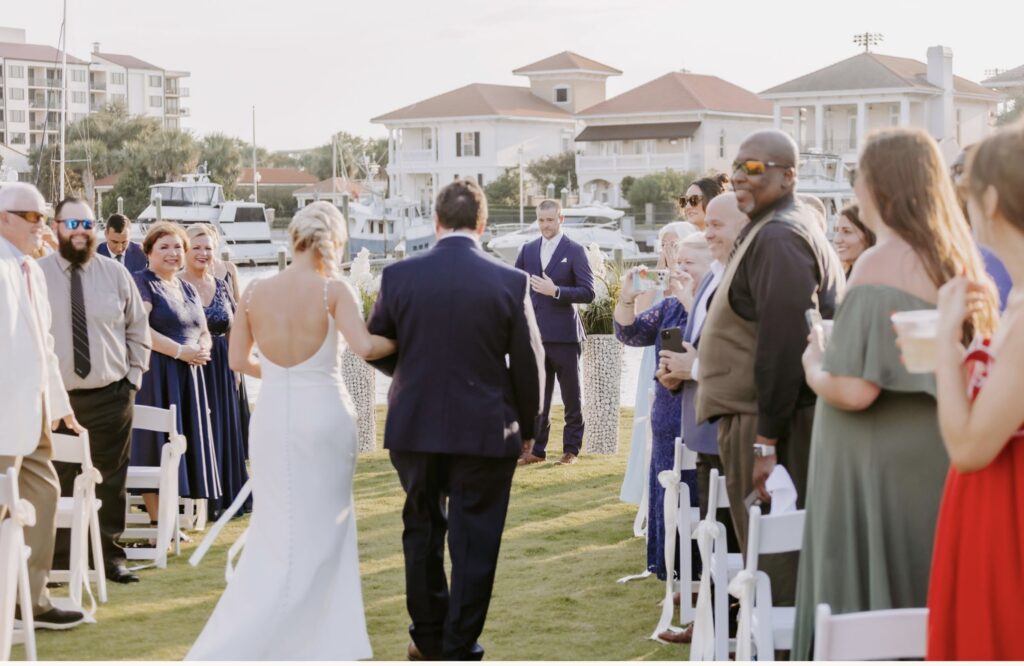 Bride being walked down the aisle on the Green.  Near Pensacola FL.  Near Destin FL.  