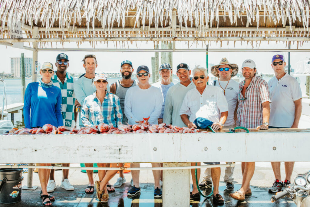 All the society members that went on the fishing trip outing and here displaying their catch near Destin at Pensacola FLorida. Garden & Gun’s Scenic Downtown Cocktail Party at Palafox Wharf Waterfront