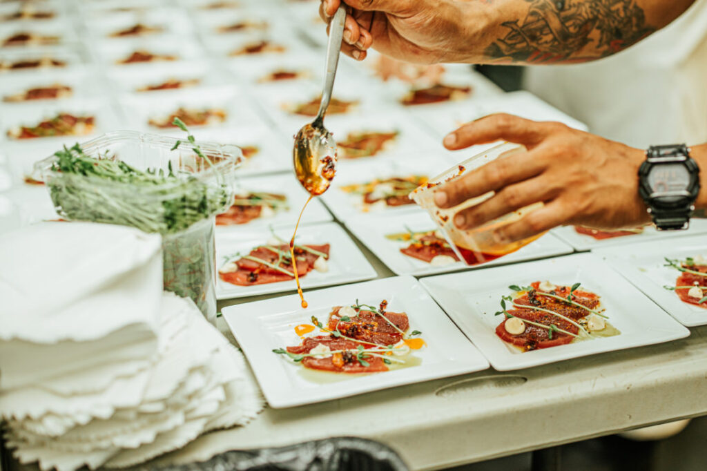 Chefs create a tasty dish of yellowfin tuna for the guests. Garden & Gun’s Scenic Downtown Cocktail Party at Palafox Wharf Waterfront