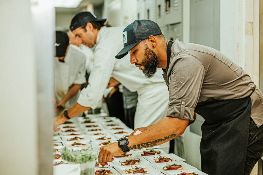 Grand Marlin’s chef plating the first course for the Garden and Gun’s guests