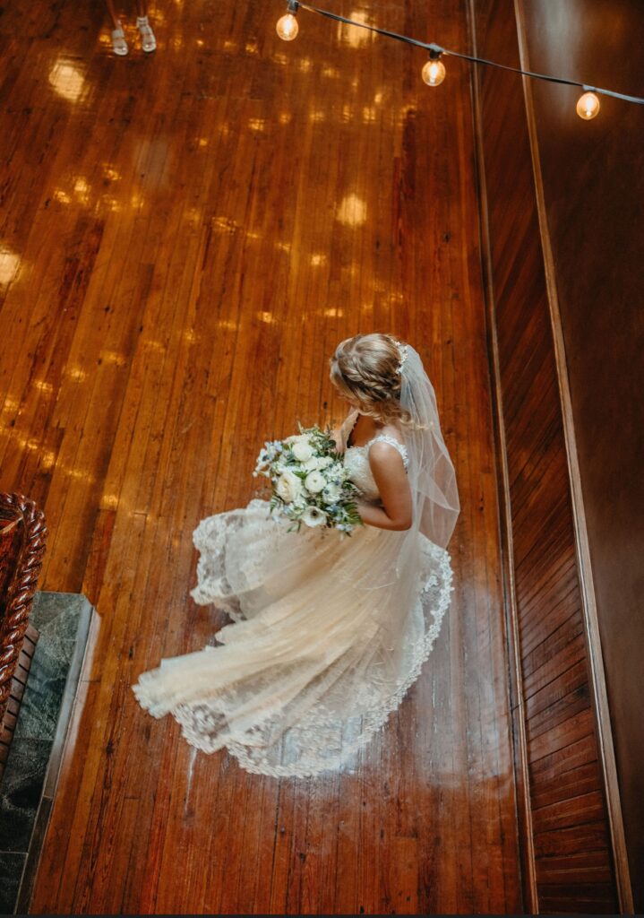 Twirling on the antique wood dance floor at Palafox Wharf Waterfront Venue