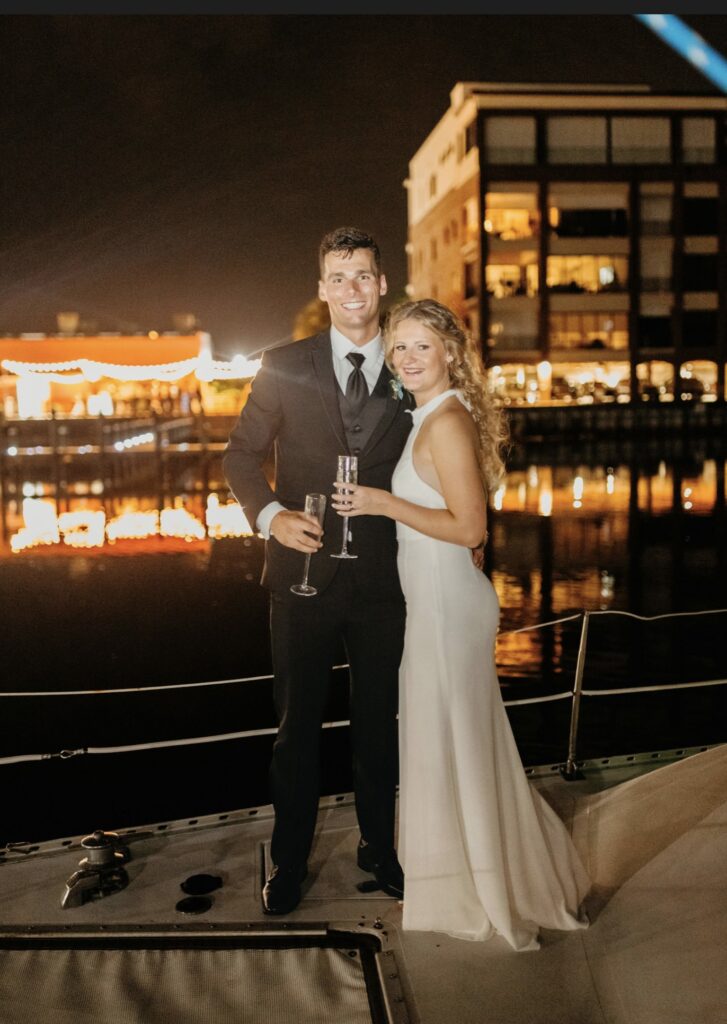 Pensacola near Destin - Couple’s Boat Exit at Palafox Wharf Waterfront with couple enjoying glass of champagne