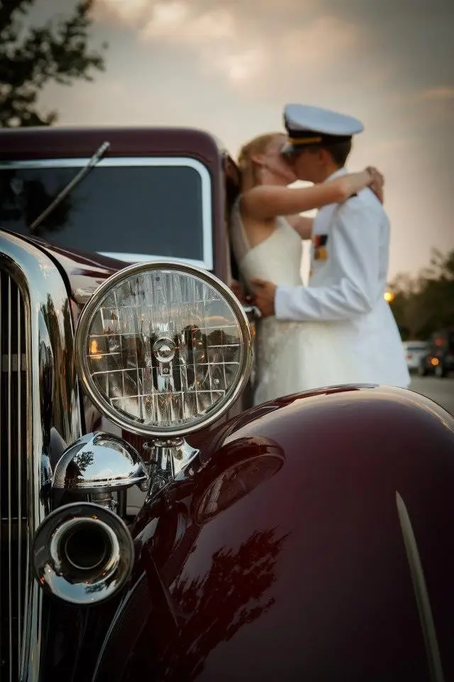 Event venue Palafox Wharf Waterfront near Pensacola near Destin.  Vintage Luxury Deep Burgundy Jag with Palafox Wharf Waterfront's military couple