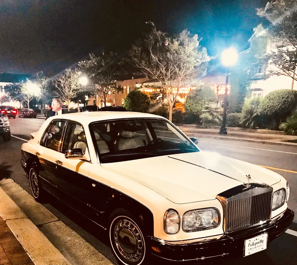 Near Destin and near Pensacola FL NWFL Downtown event venue wedding venue Creme and Navy Blue Rolls Royce for Palafox Wharf's get-away vehicle