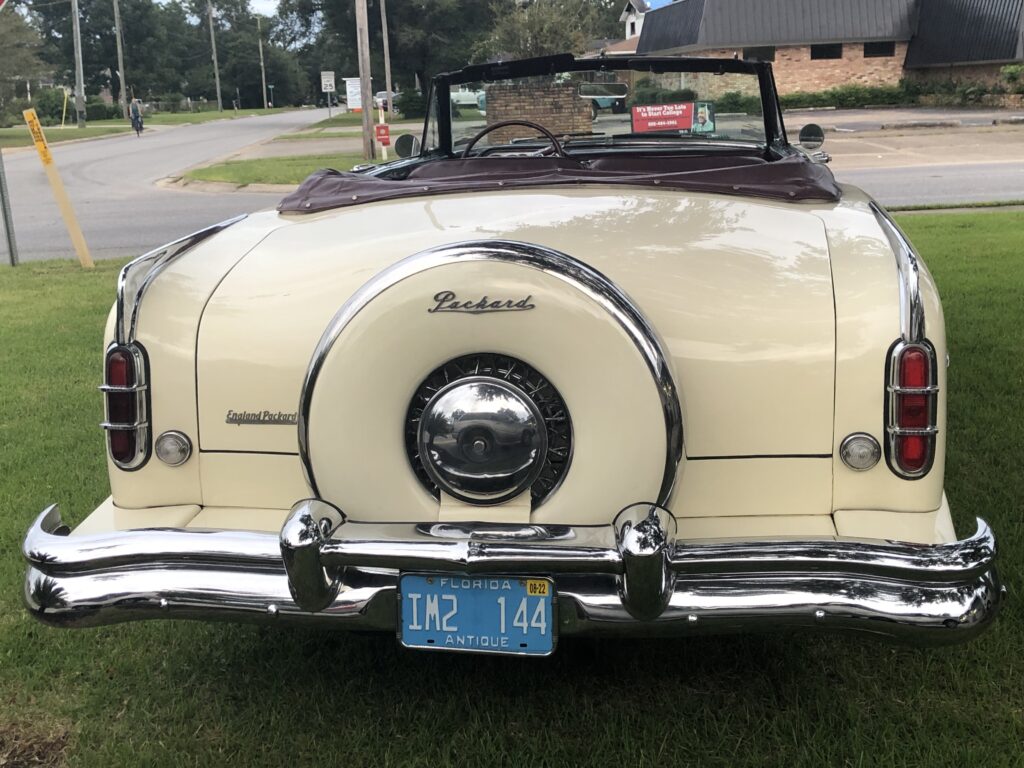 Downtown Pensacola and near Destin FL 1953 Ivory Packard Convertible with deep red interior is a high light in the Pensacola area for send off