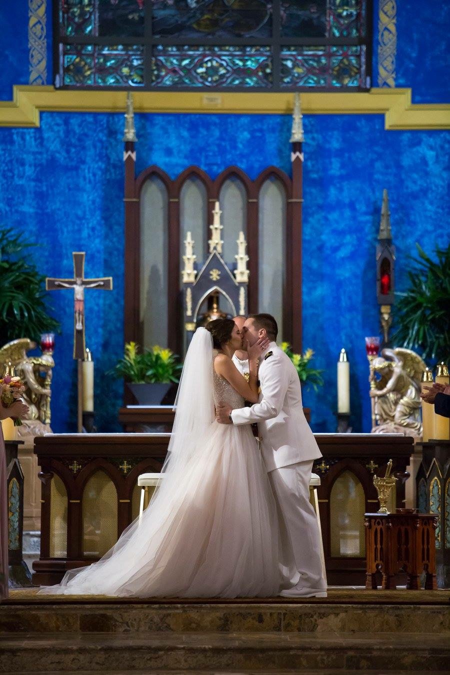 Pensacola near Destin Florida this couple married at St. Patricks Cathedral Pensacola kissing right at the conclusion of ceremony