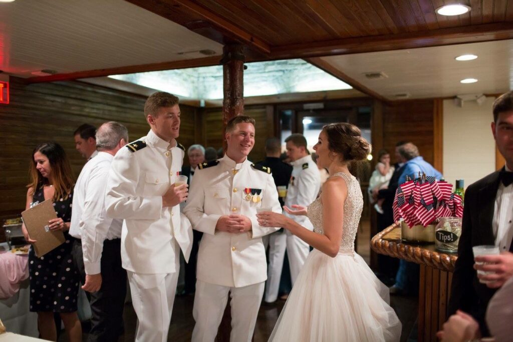 Event Wedding venue Pensacola near Destin Florida Palafox Wharf's Bride chatting with military guests in the cocktail bar area