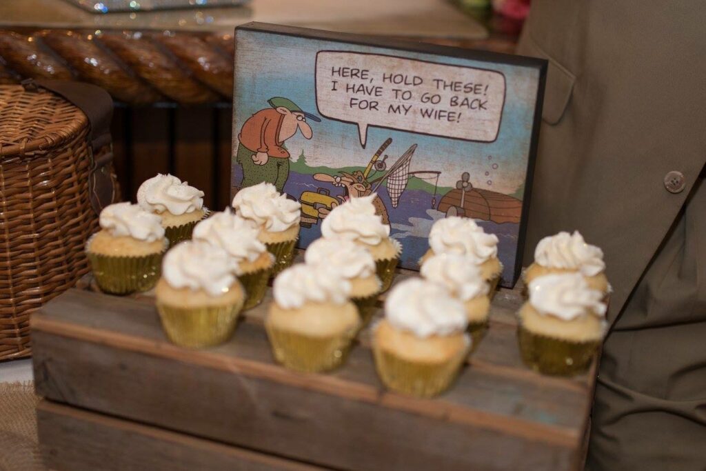 Event Wedding venue Pensacola near Destin Florida Cute Comic in front of tasty mini cheesecakes on wood stand