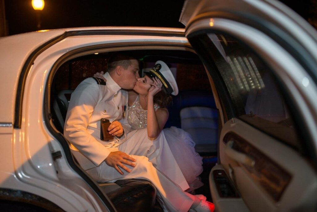 Event Wedding venue Pensacola near Destin Florida Couple exiting with a kiss in their get-away vehicle