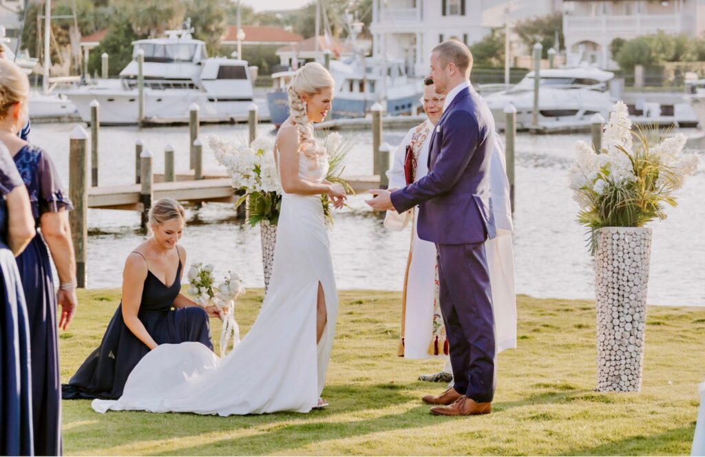 Couple at Ceremony on The Green at Palafox Wharf Waterfront