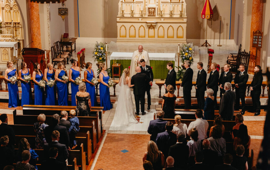 Couple’s ceremony at St. Michael’s in Pensacola Florida with bridesmaids, groomsmen, and guests