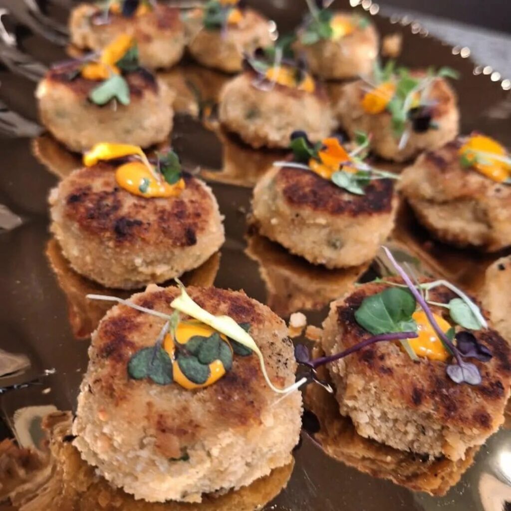 Chef Bob’s award winning crab cakes with micro flowers and greens perfect for you Elevate Your Wedding with Farm-to-Table Menus and Chef Bob