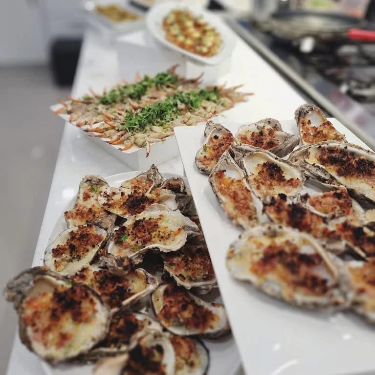 Emerald Coast Private Chefs’ Broiled Oyster with Jalapeño and Conecuh, Marinated Blue Crab Claws a special delight to Elevate Your Wedding with Farm-to-Table Menus