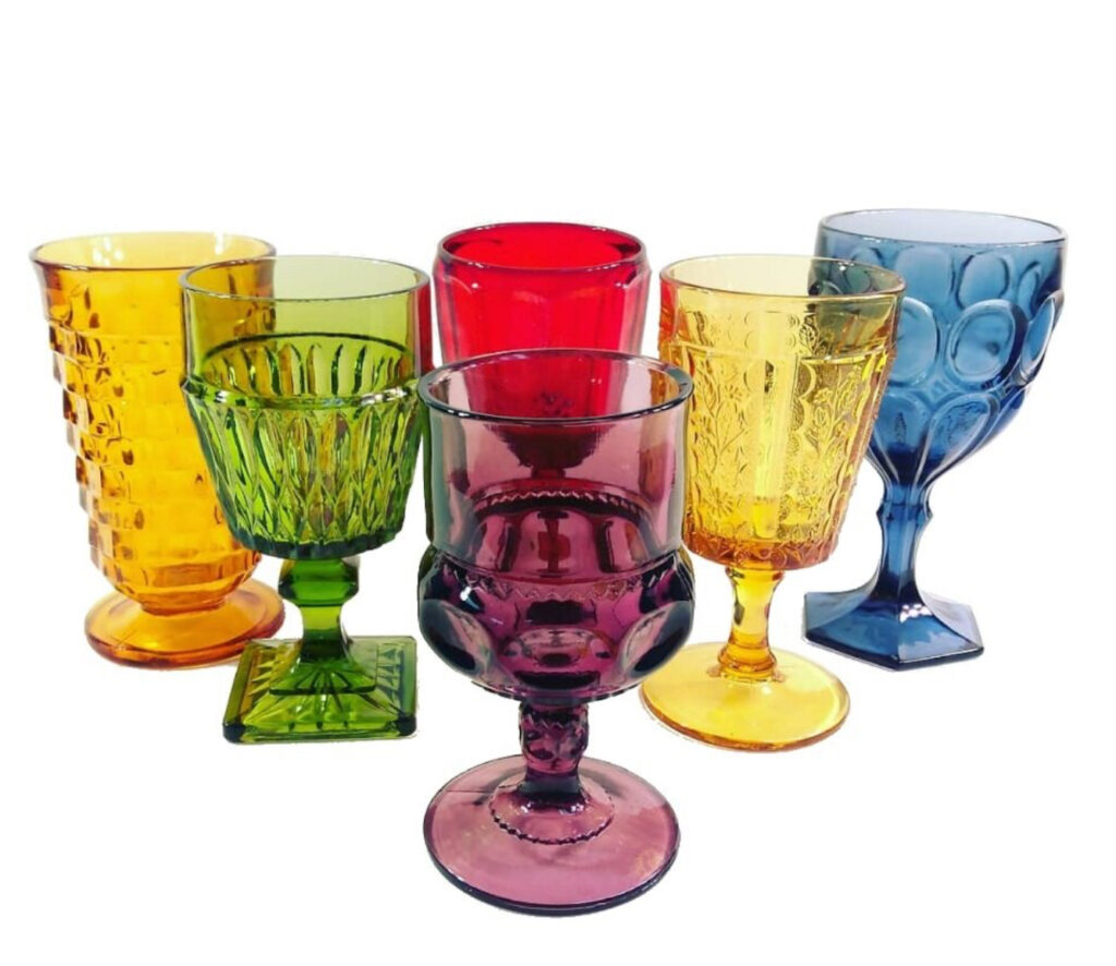 Mismatched colored glassware for wedding reception tableware
