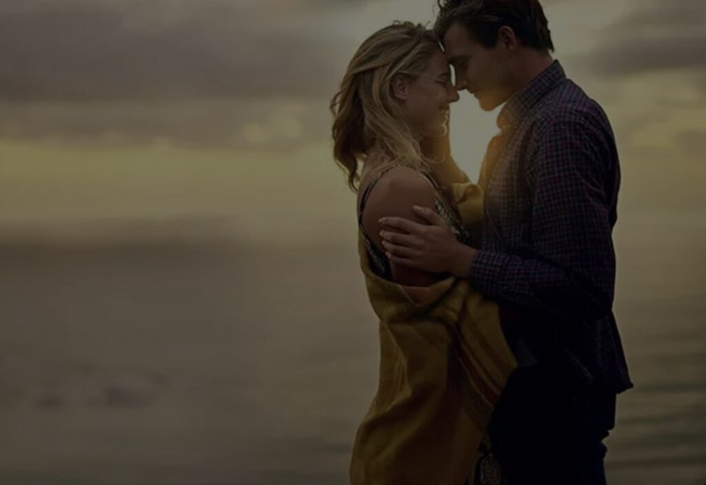 Here is Palafox Wharf Waterfront Wedding Venue showing a how to pose which is a dreamy pose forehead to forehead of a smiling just engaged couple with a beautiful embrace.  Great example of how to pose for unique engagement photos.  How to Wedding Plan