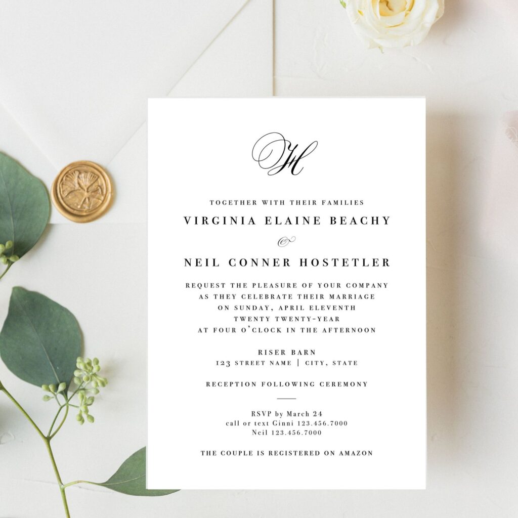 Pensacola Wedding Venue Palafox Wharf Waterfront Wedding Venue is showing a simple creme wedding invitation with monogram stamp and green leaves and ivory floral