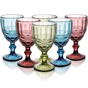 Various colored stemmed glass water goblets shown by Palafox Wharf Waterfront Wedding Venue in Pensacola near Destin and near Mobile