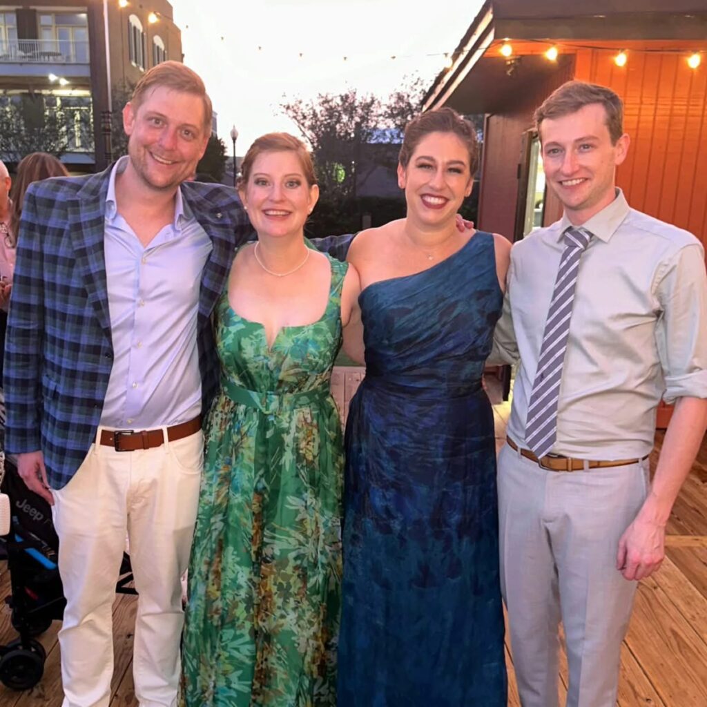 Wedding Venues Pensacola showing guests at a Wedding Celebration for their fellow doctors having been married with married couple and their 2 friends on the deck 