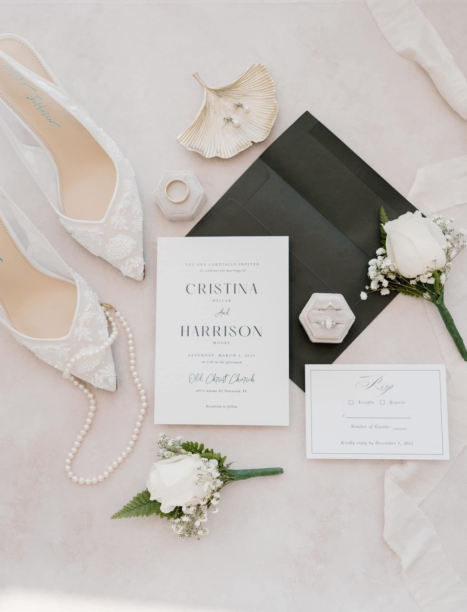 Bridal bouquet with white roses and baby's breath, paired with lace wedding heels and veil at a Pensacola Wedding Venue - Old Christ Church - elegant details for couples budgeting their wedding costs in Pensacola.