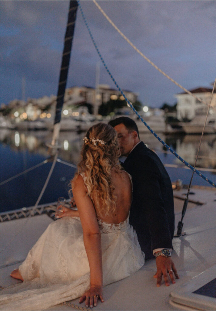 wedding venues in pensacola fl with bride and groom taking a boat ride in the golden hour with gorgeous background