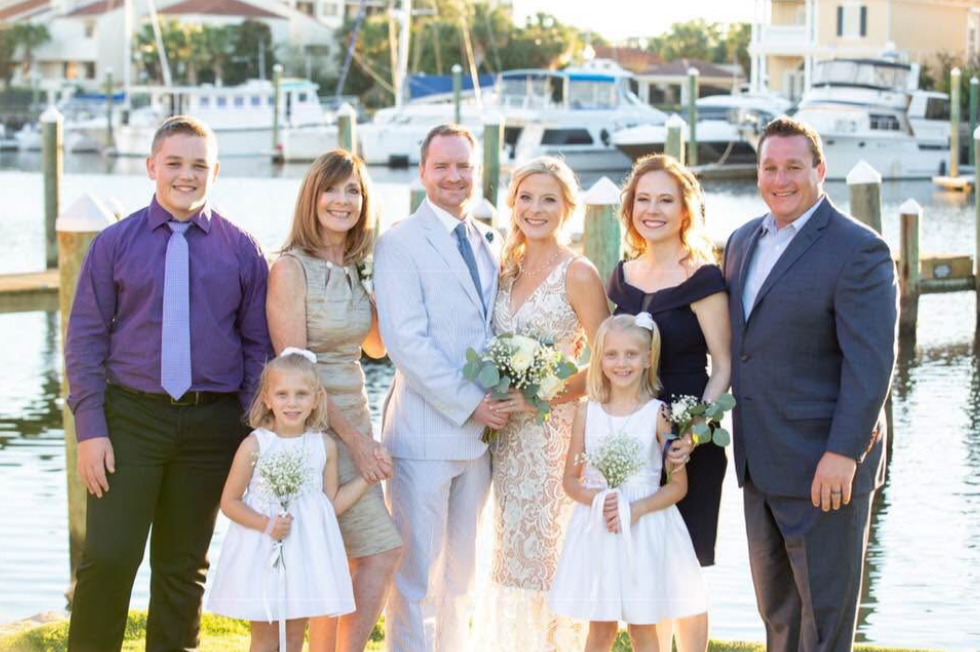 Palafox wharf waterfront wedding venue photos and this one with the family on the water
