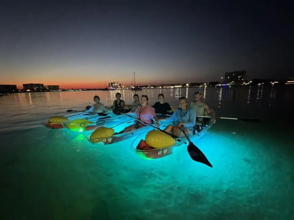 paddleboard at night with friends and family after you have gone to Palafox Wharf Waterfront wedding venue for your event tour