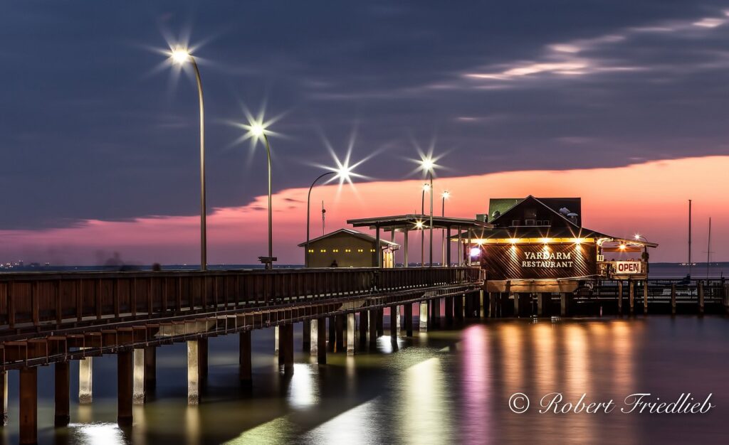 Scenic pier at sunset, perfect for unique wedding places Pensacola FL outdoor receptions and dining