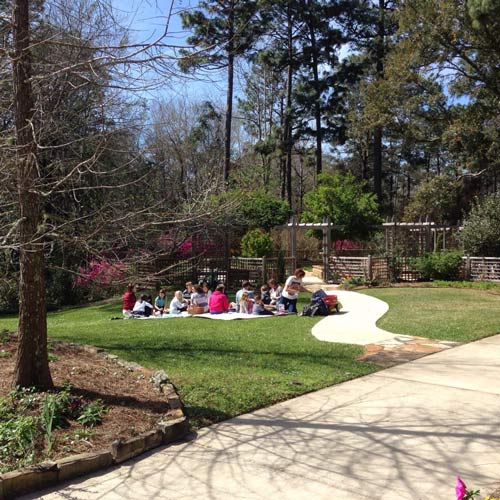 Scenic picnic in a lush garden, perfect for a couples retreat in Mobile outdoor events
