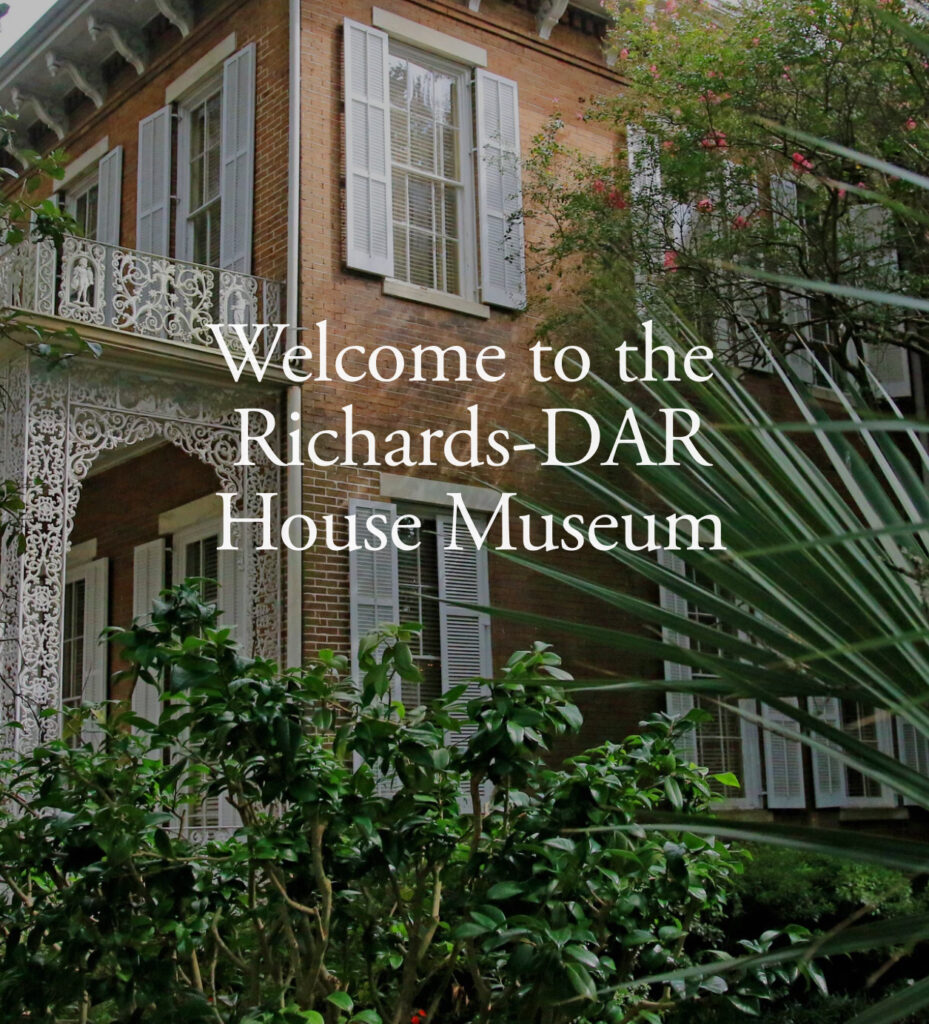Come to the Richards-Dar House Museum which is brick with white shutters with ornate railing and porch in mobile 