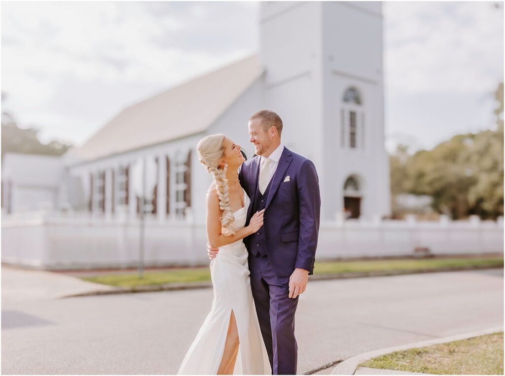 wedding venues near me with Couple in wedding attire outside church.