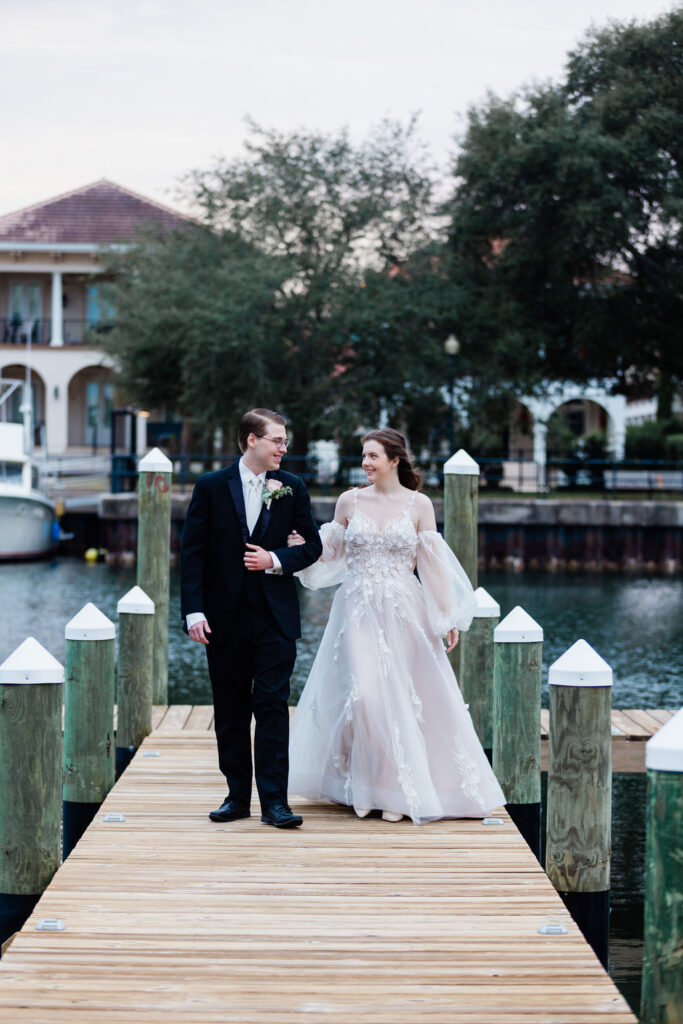 Wedding venue Pensacola with bride and groom on waterfront deck