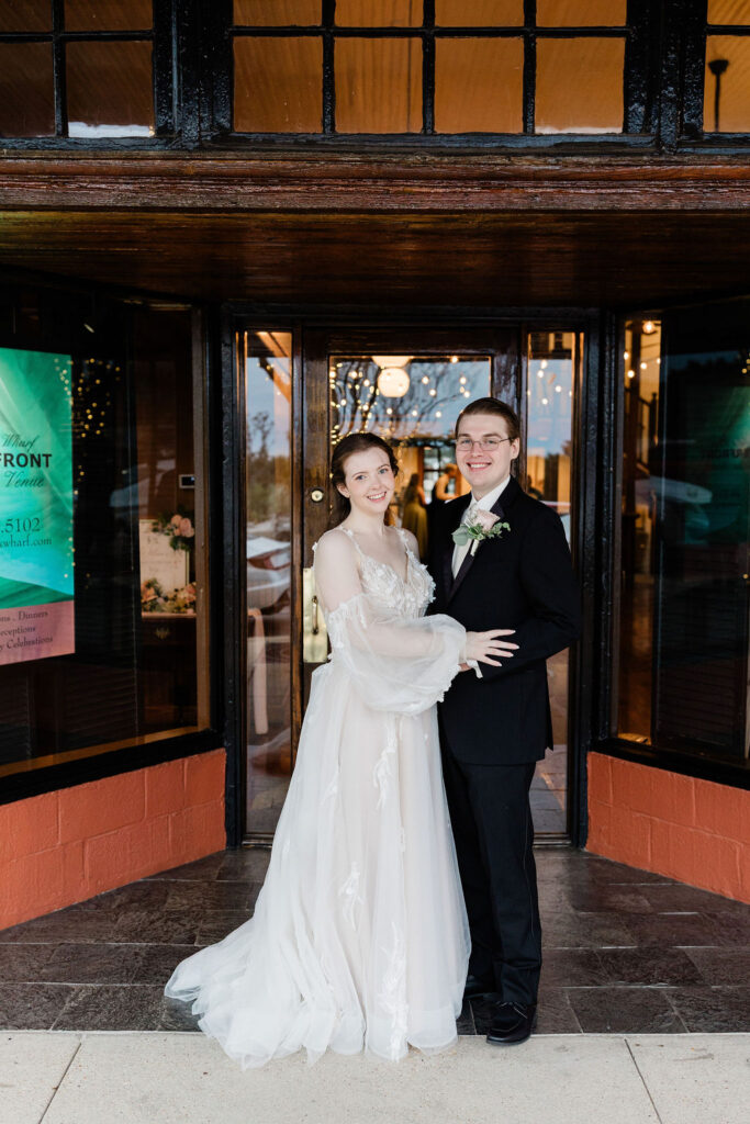 pensacola wedding venue with couple in front of palafox wharf's front door