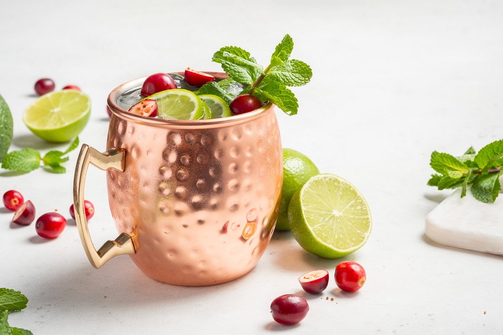 Wedding venues pensacola fl with cranberry and lime cocktail in copper mule